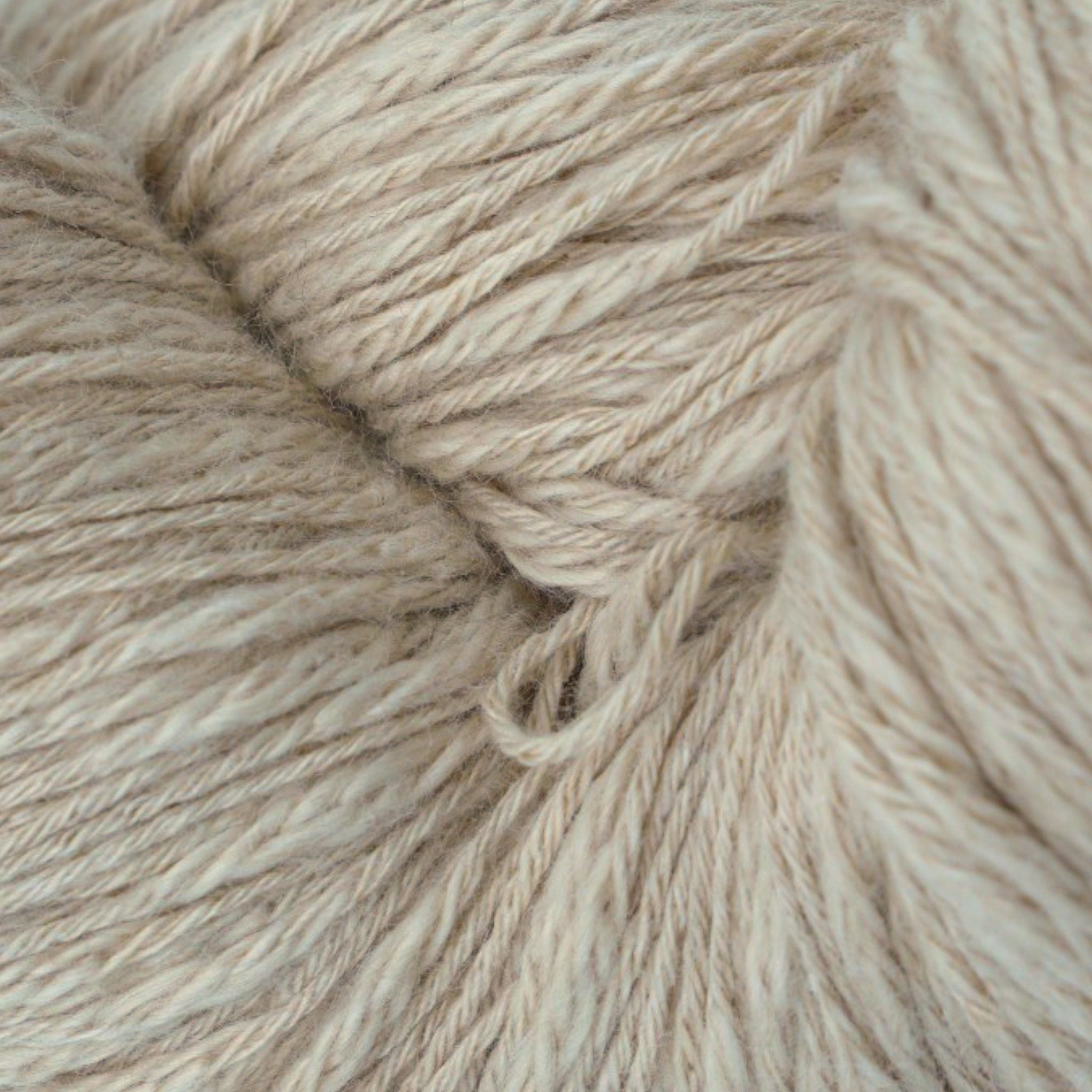 A skein of beige cotton slub yarn.