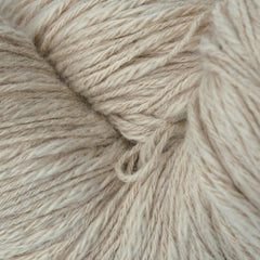 A skein of beige cotton slub yarn.
