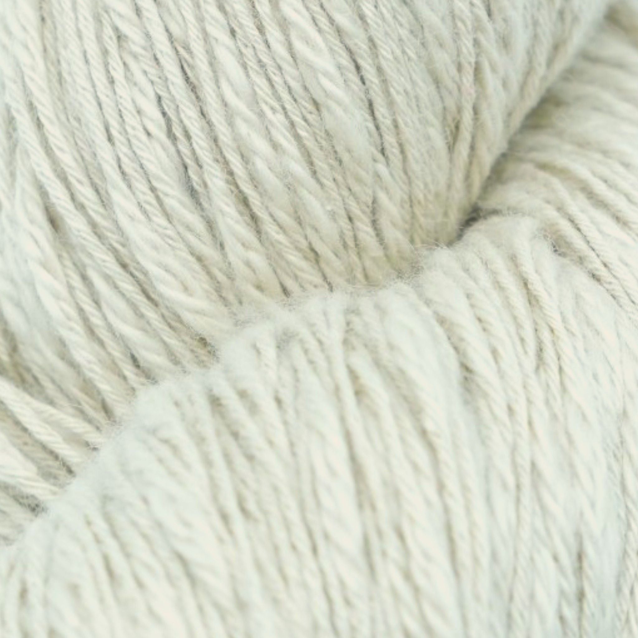 A skein of white cotton slub yarn.