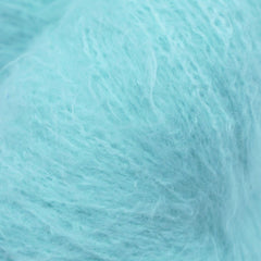 A skein of fuzzy lace yarn in a light blue color, displayed against a plain background.