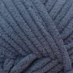 Close-up of a blue textured fabric with a knitted pattern