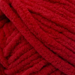 Close-up of red yarn with a textured pattern