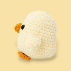 Side profile of Jackson the baby booty chicken pale yellow chick crochet chicken