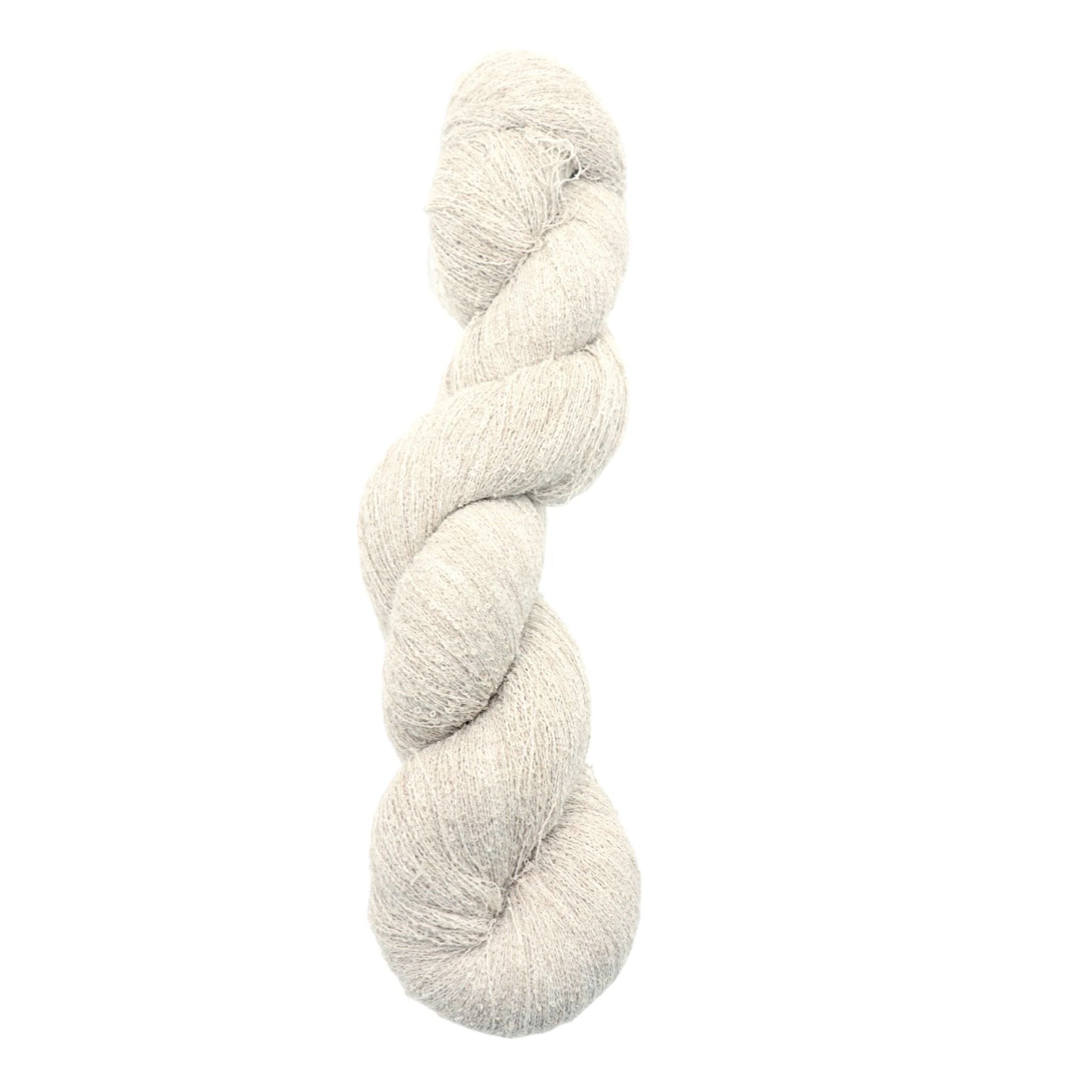 Single skein of cream-colored yarn on a white background