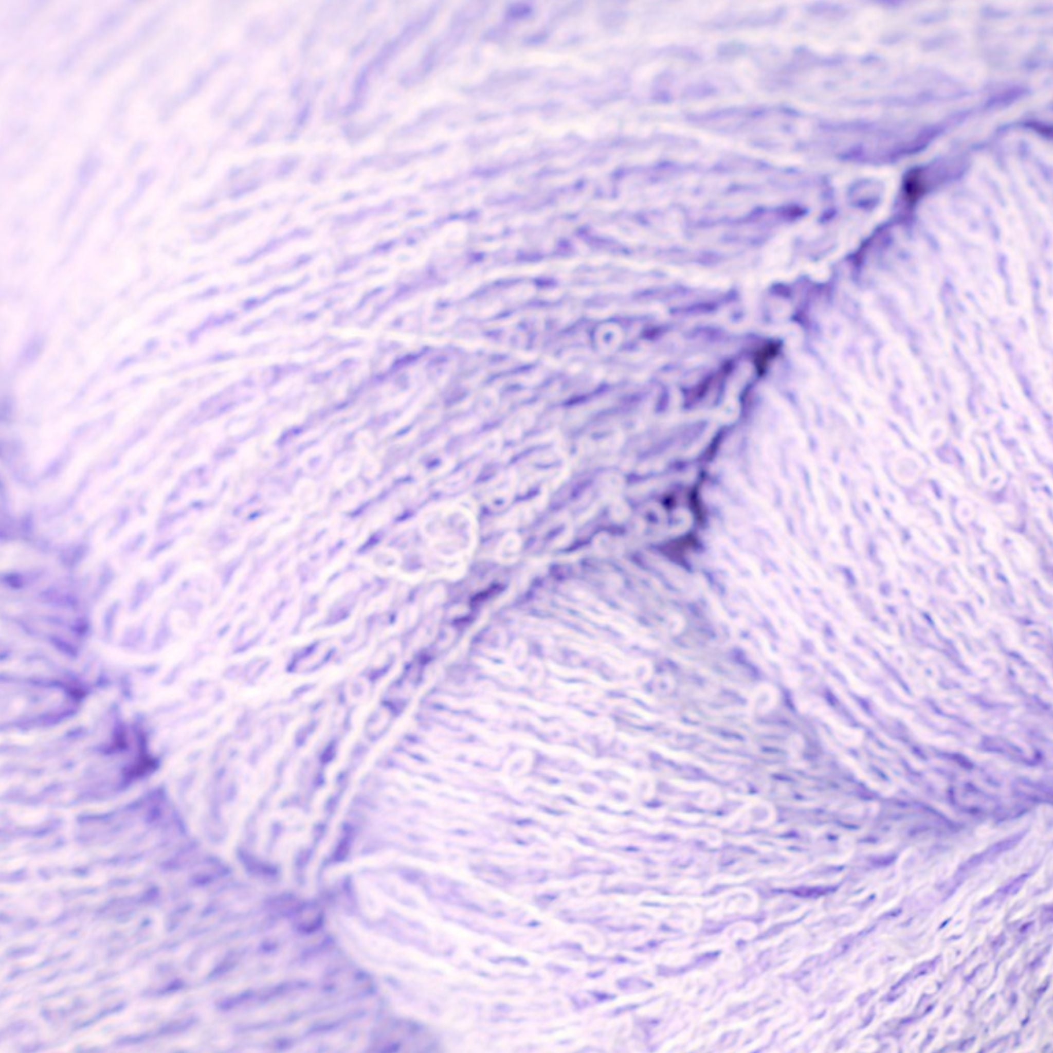 Close-up of purple yarn with a textured looped surface