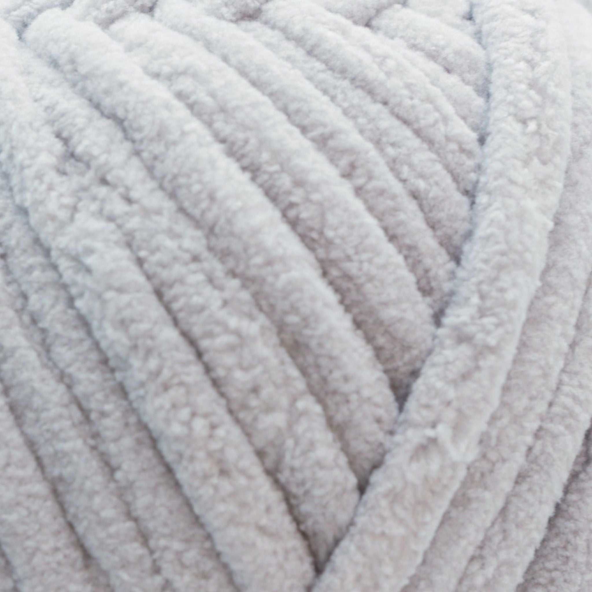 a skein of size 7 jumbo yarn in a grey color