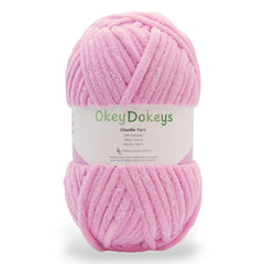 A skein of pink jumbo 7 yarn with a okey dokeys label