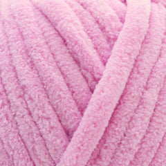 A skein of Okey Dokeys brand Jumbo Velvet Chenille Yarn in pink color.