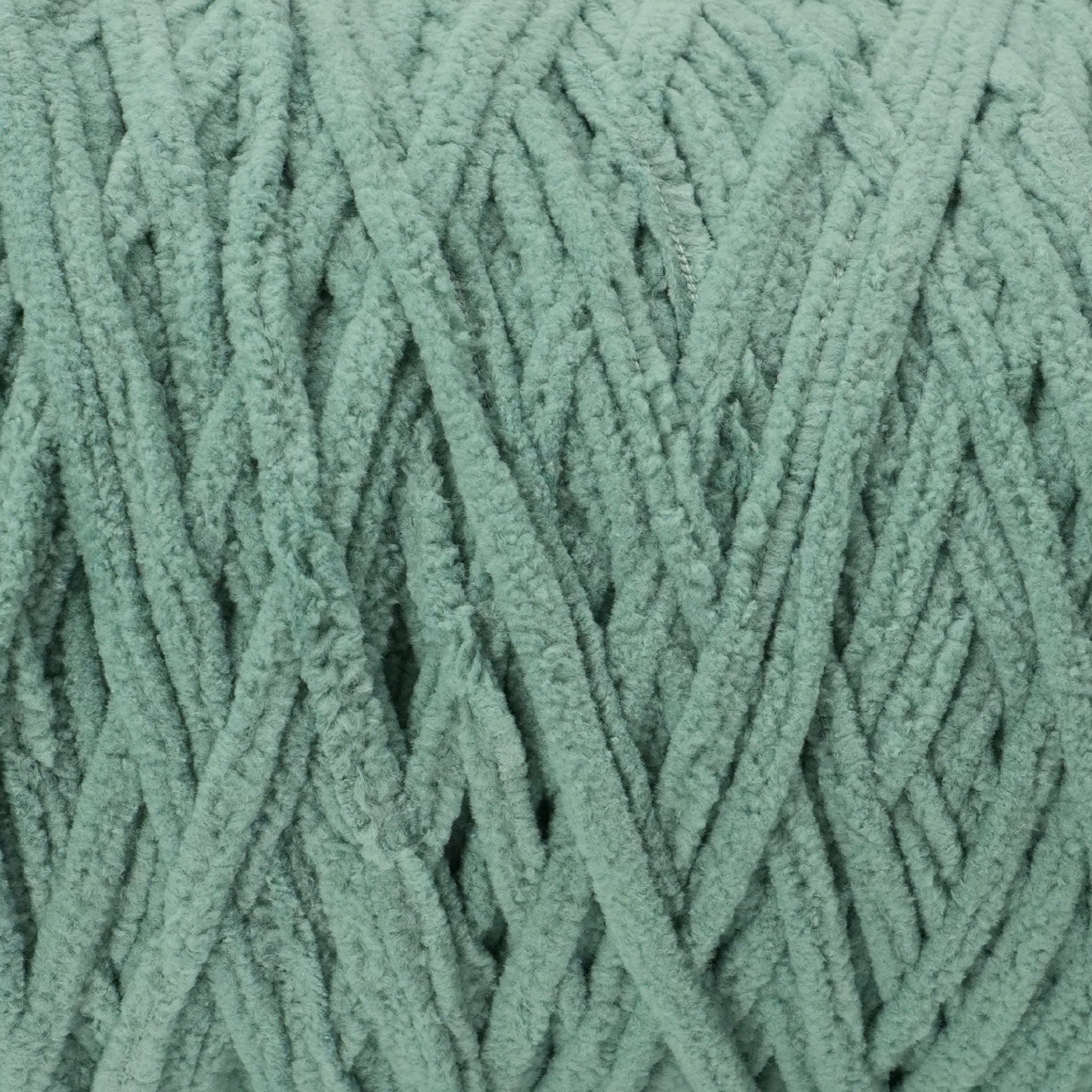 detailed close up of our super soft chenille yarn in green sage color