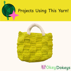 Yellow woven bag with white handle on a white background in chenille yarn