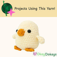 Crocheted chick toy with text 'Projects Using This Yarn!' and 'Okey Dokeys' branding on a beige background.