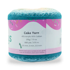 Blue cake yarn with a colorful label on a white background