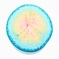 Multicolored yarn ball with a gradient from blue to pink on a white background