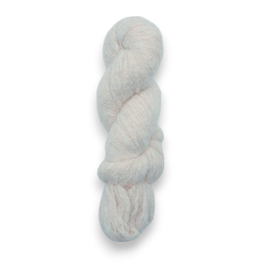 A skein of fine eyelash yarn in a white color.