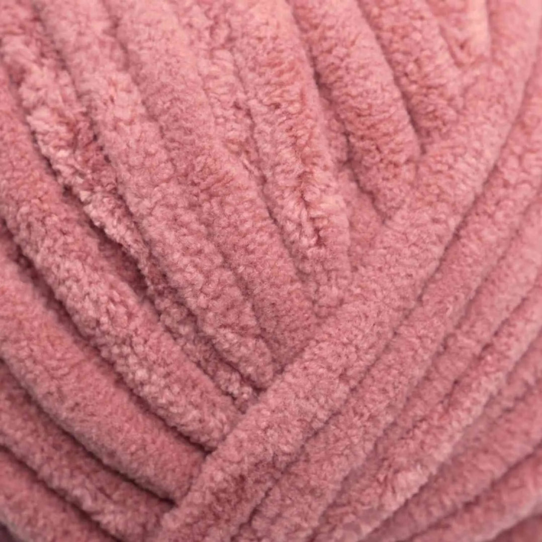 Close-up of pink textured yarn ball