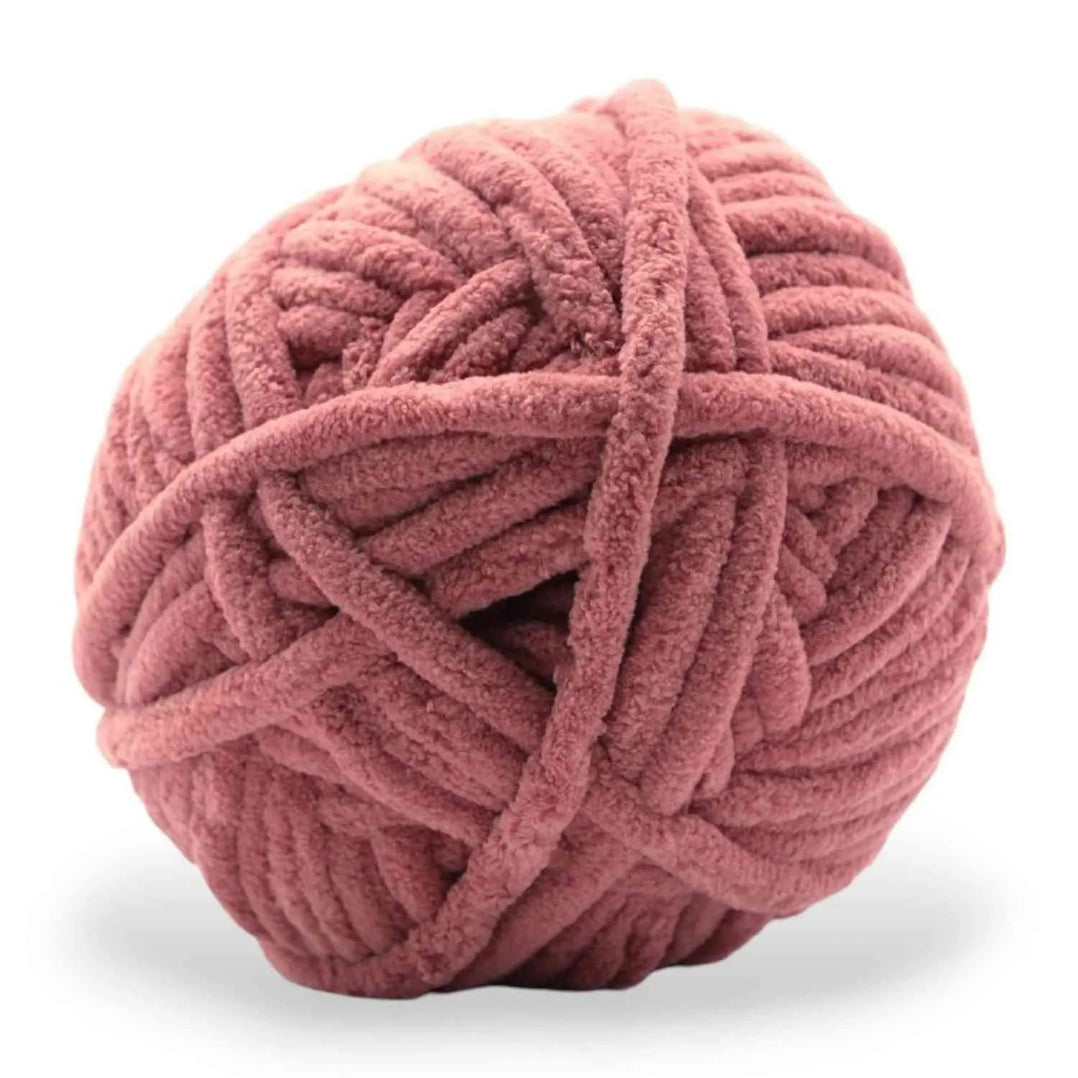 Pink skein of yarn on a white background