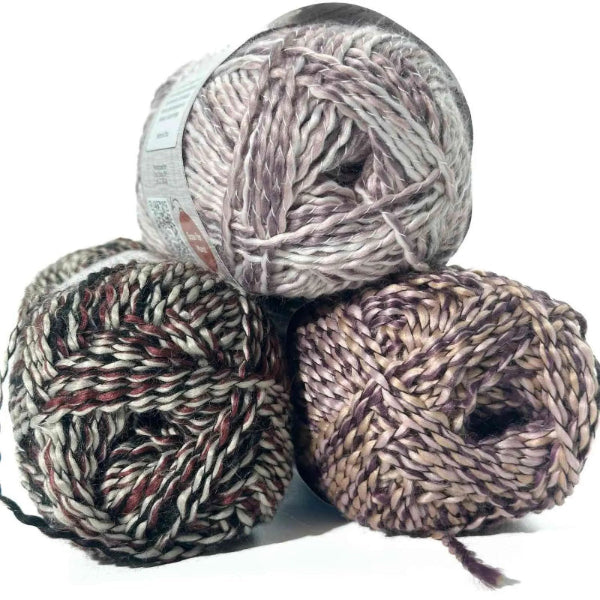 Three skeins of yarn with a pattern on a white background