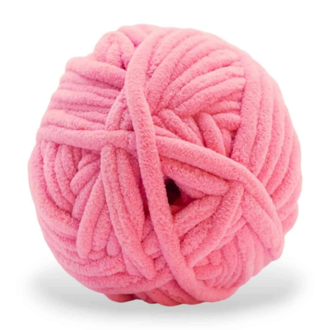 Pink skein of yarn on a white background