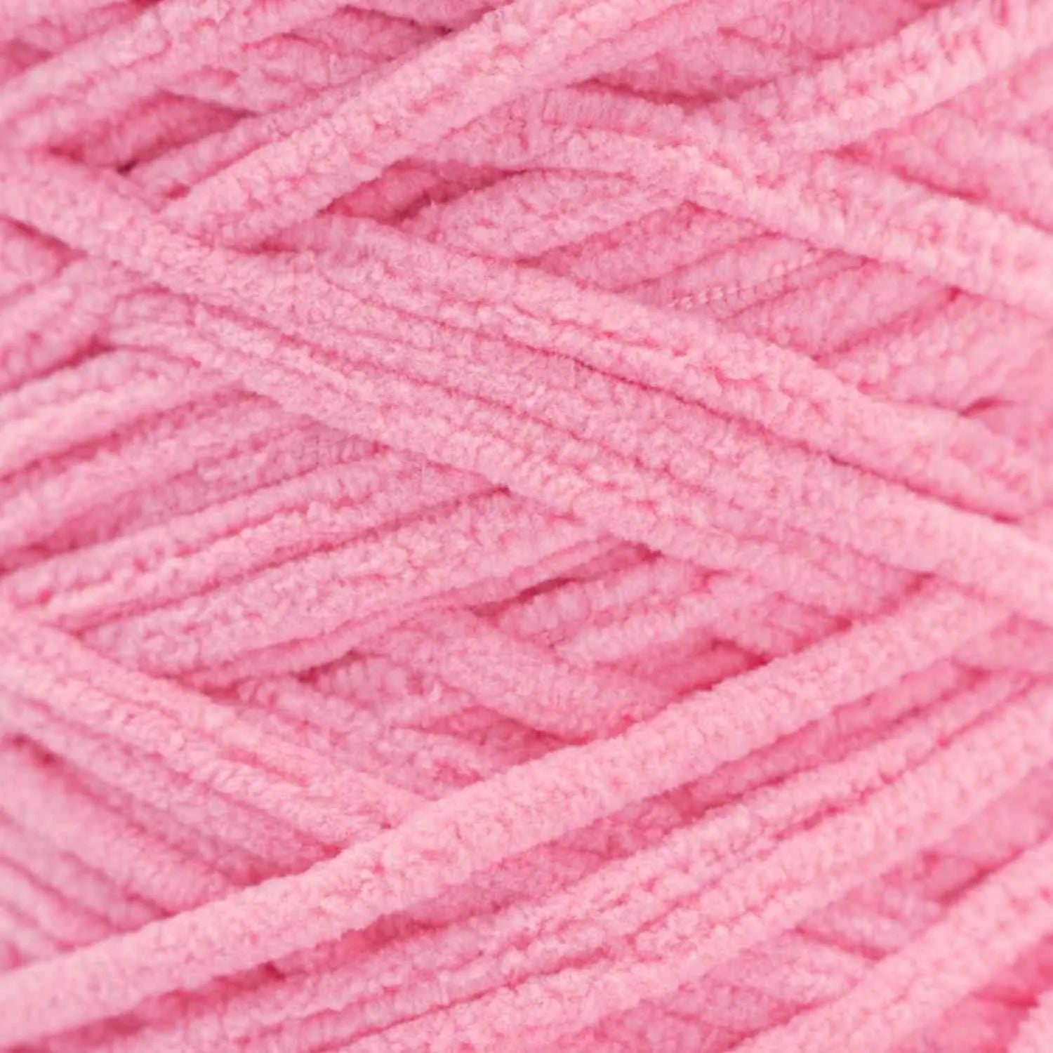 Close-up of pink yarn with a textured surface