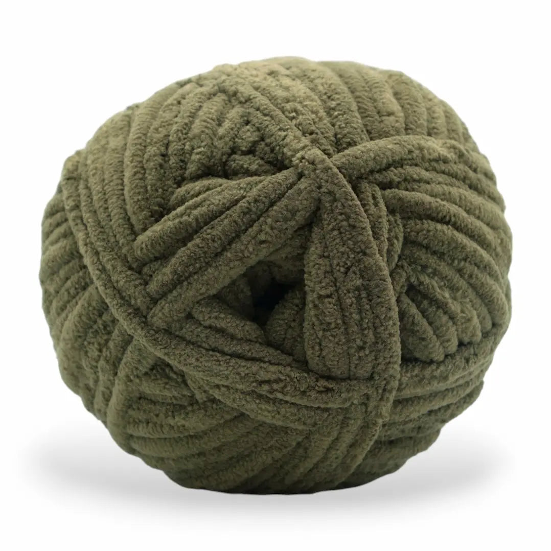 Green skein of yarn on a white background