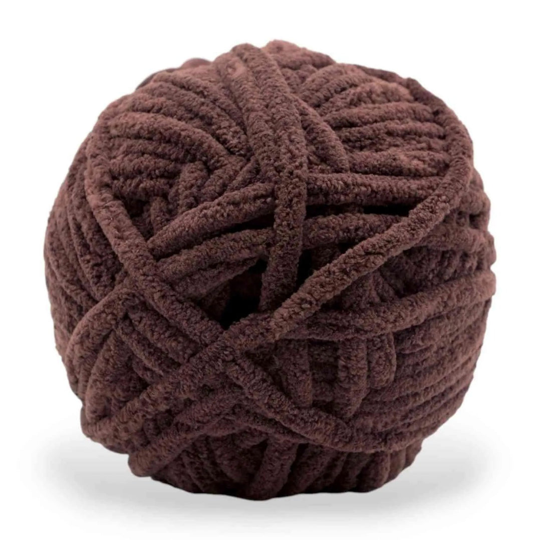Brown ball of yarn on a white background