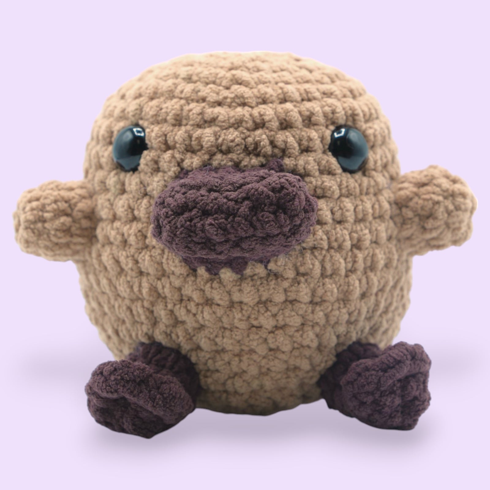 a image of a cute amigurumi platypus made from okey dokeys tuff teddy chenille yarn