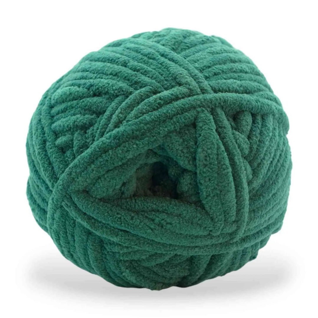 Green skein of yarn on a white background