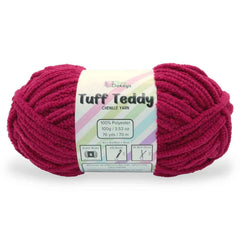 Ball of pink yarn with a label on a white background