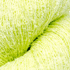 close up of yellow boucle yarn for knitting 