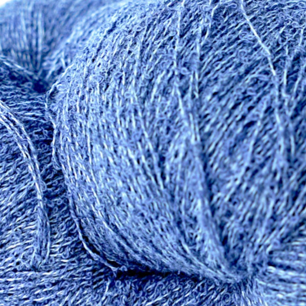 close up view of purple boucle yarn