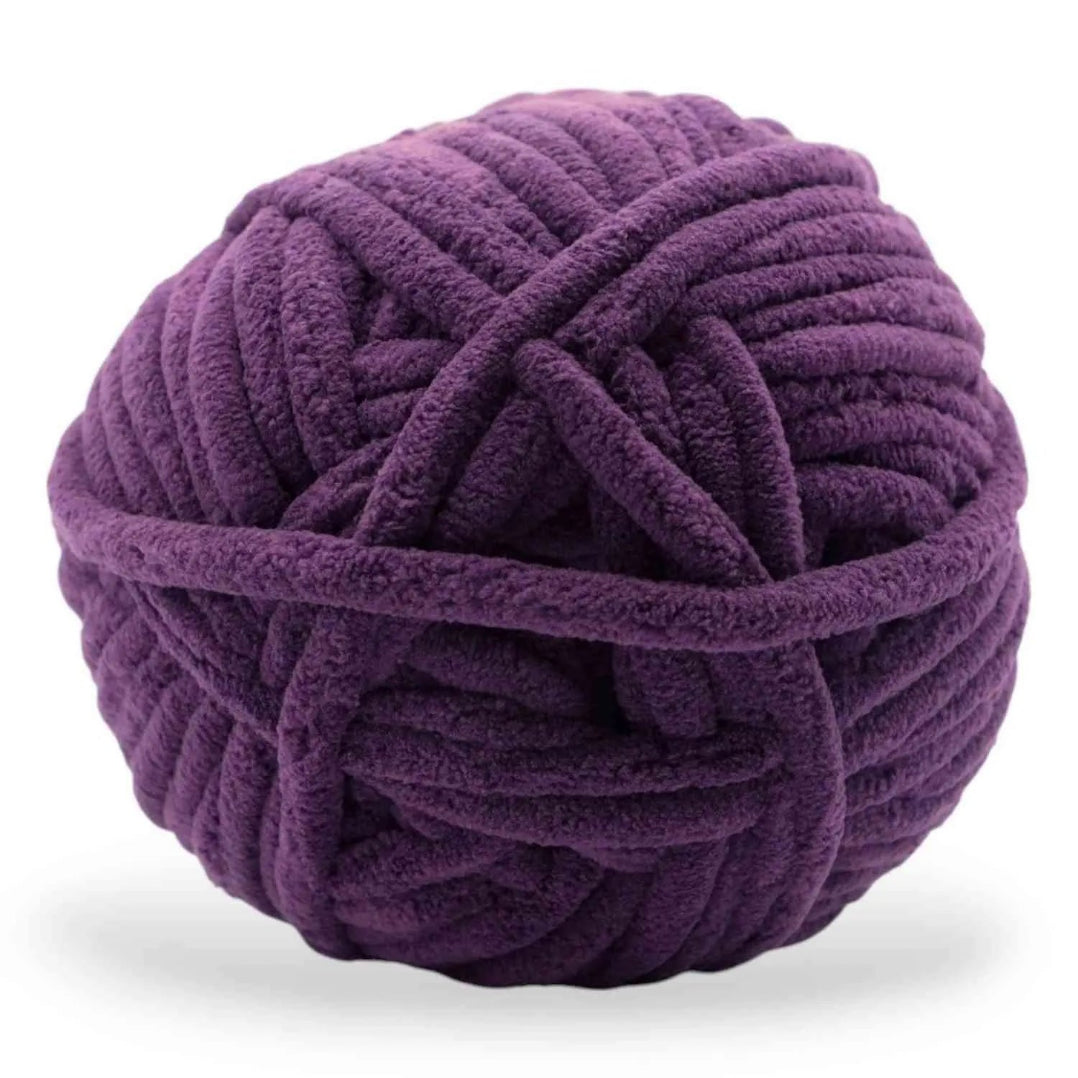 Purple ball of yarn on a white background