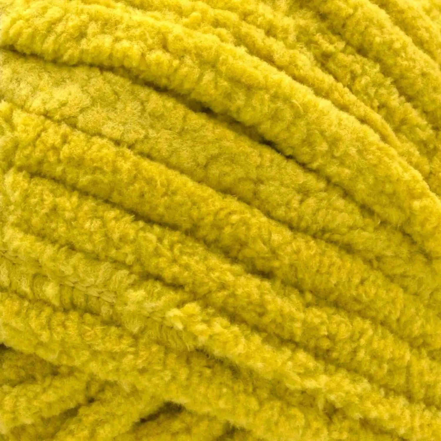 Close-up of a ball of bright yellow yarn