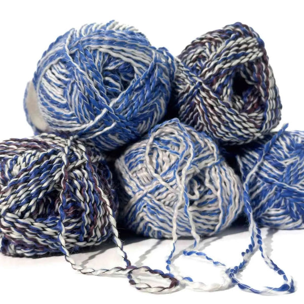 Blue and white yarn balls on a white background