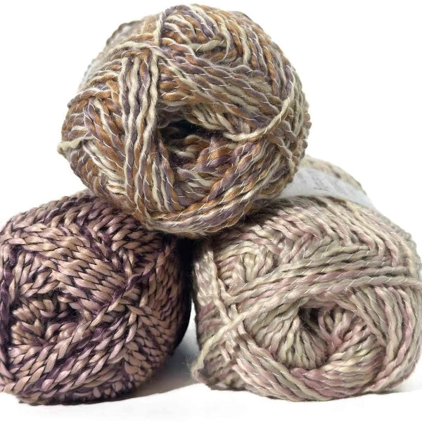 Three skeins of multicolored yarn on a white background