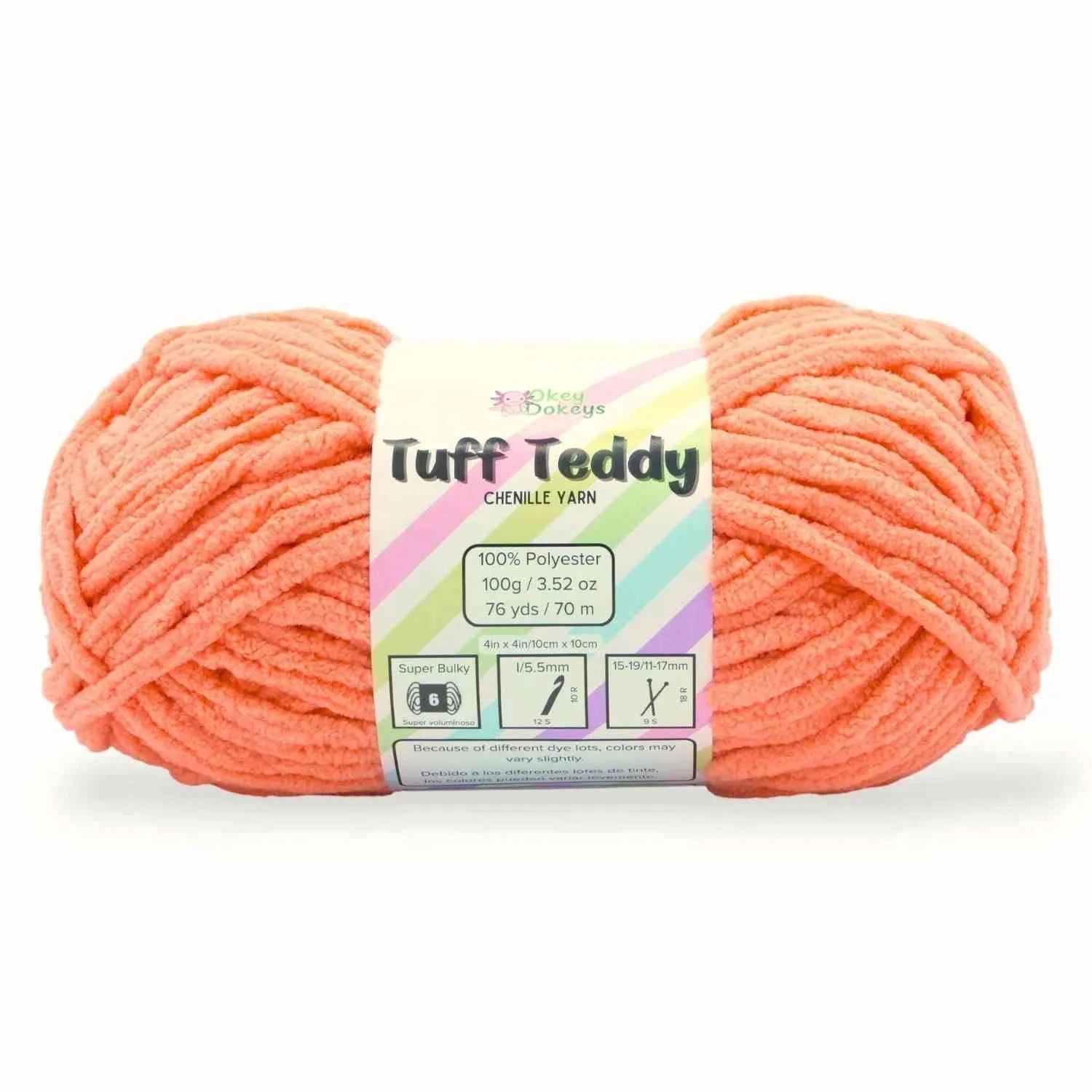 Ball of coral yarn with a label on a white background