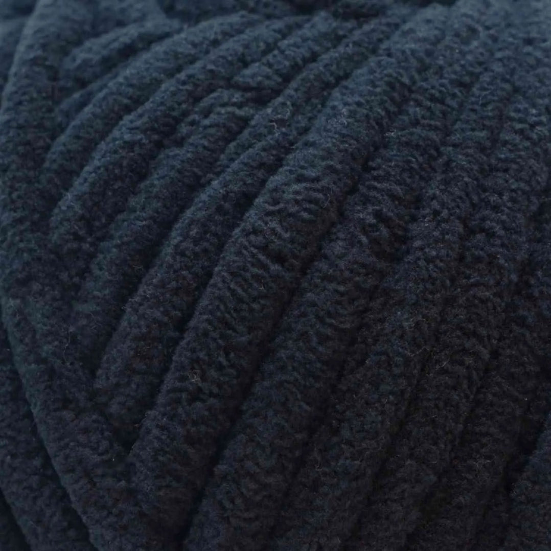 Close-up of a ball of dark blue yarn