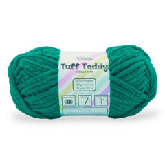Green skein of yarn with a label on a white background