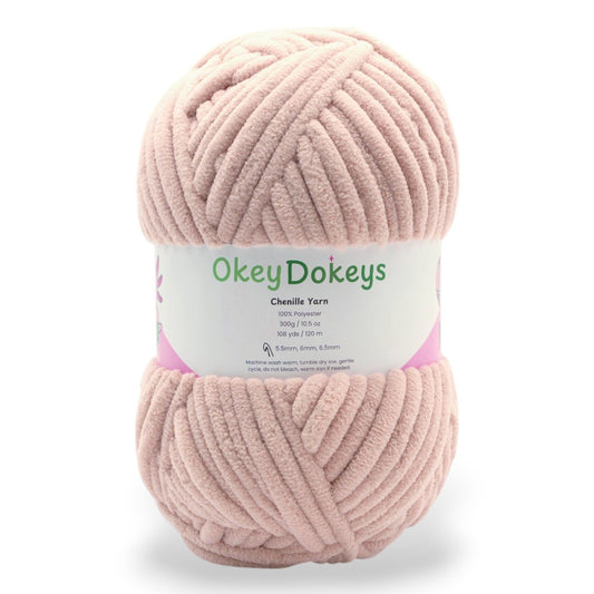 A skein of Okey Dokeys brand Jumbo Velvet Chenille Yarn in pink color.