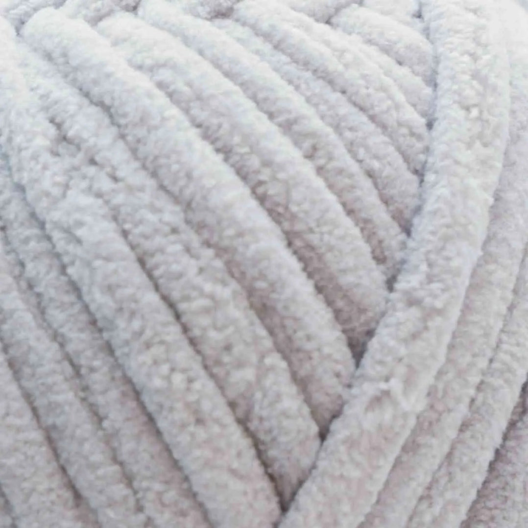 Close-up of a ball of light gray yarn