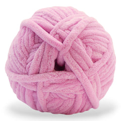 jumbo weight yarn in a pink tone on its side showing its super soft texture