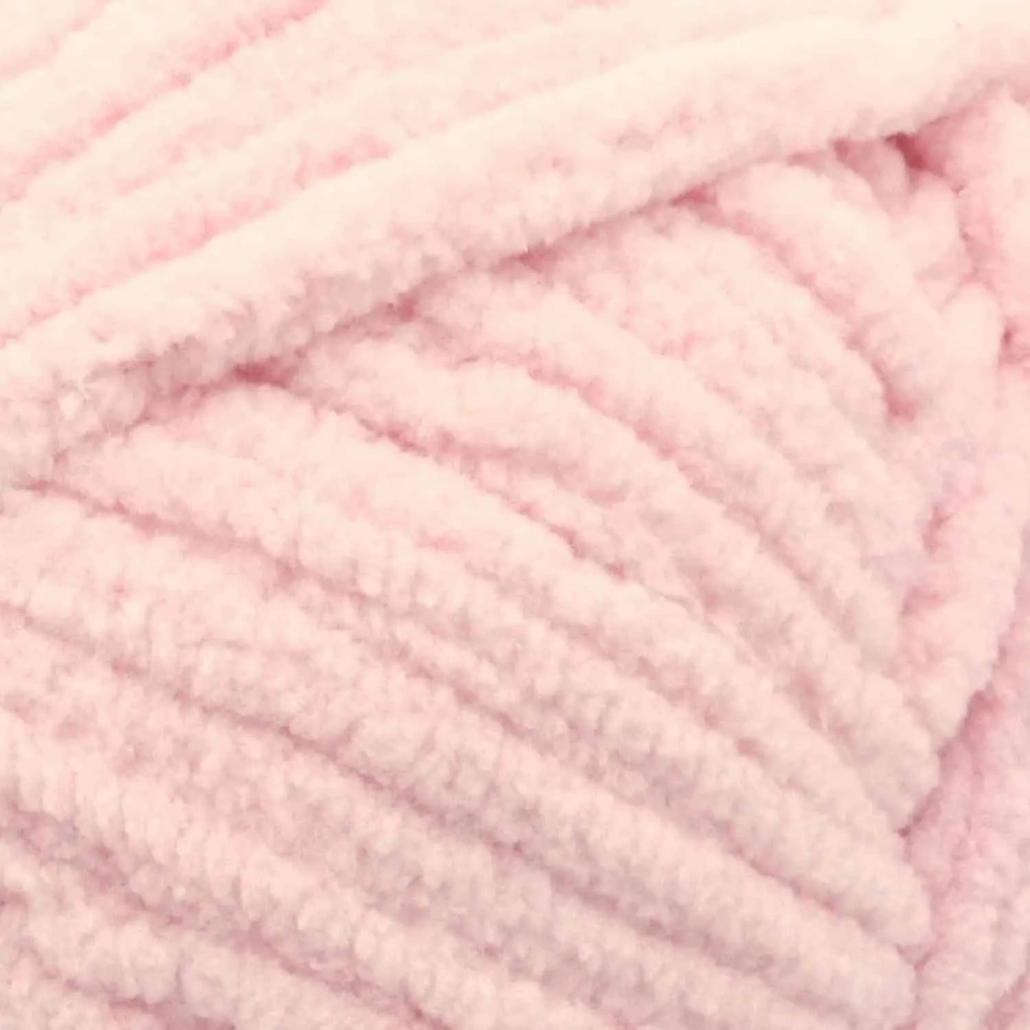 Close-up of pink yarn with a soft texture