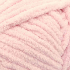 Close-up of pink yarn with a soft texture