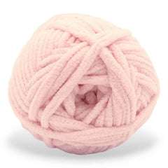 Pink ball of yarn on a white background