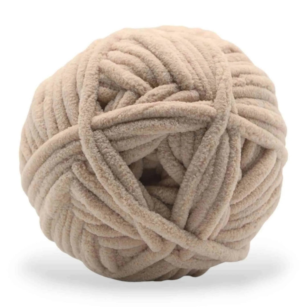 Beige skein of yarn on a white background