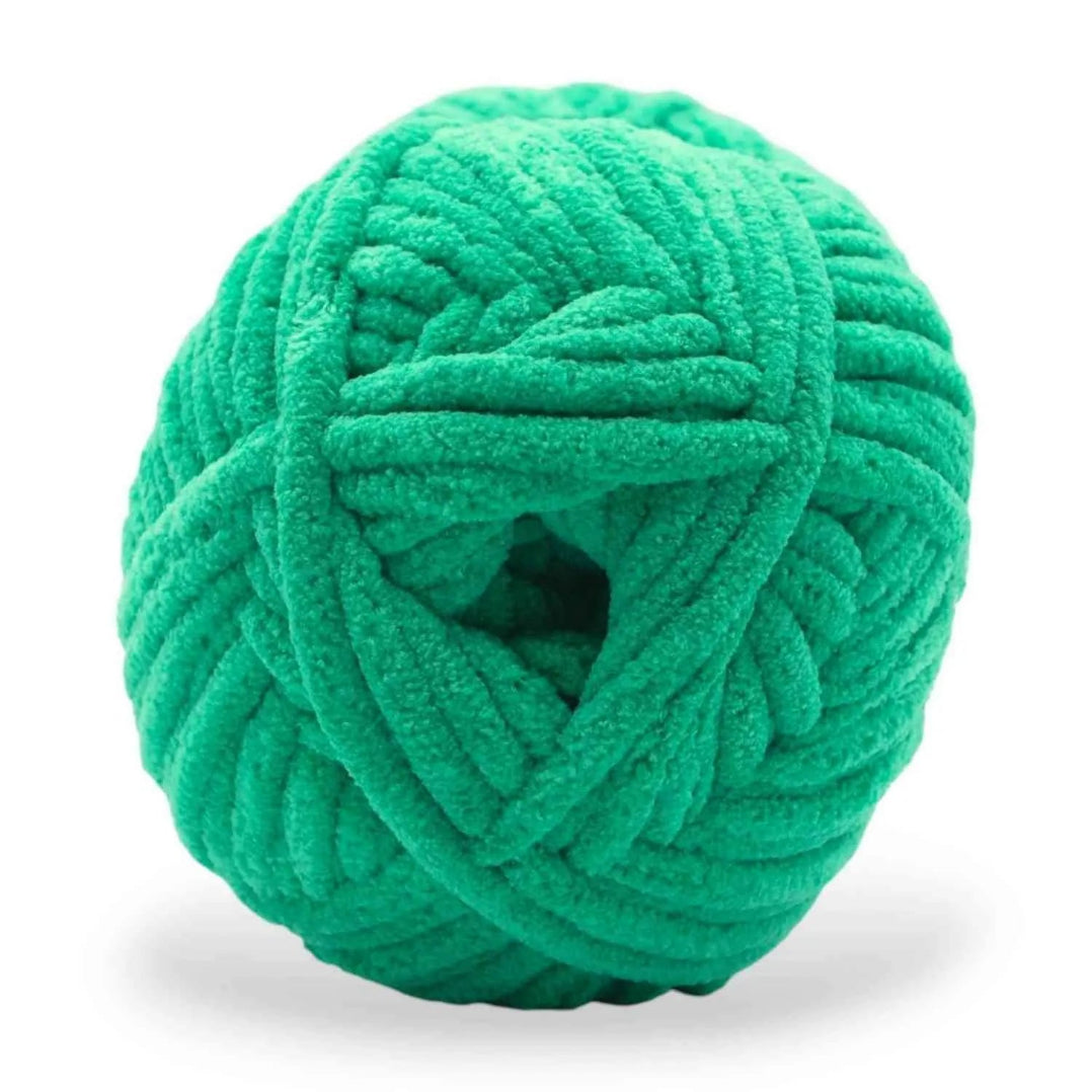 Green skein of yarn on a white background