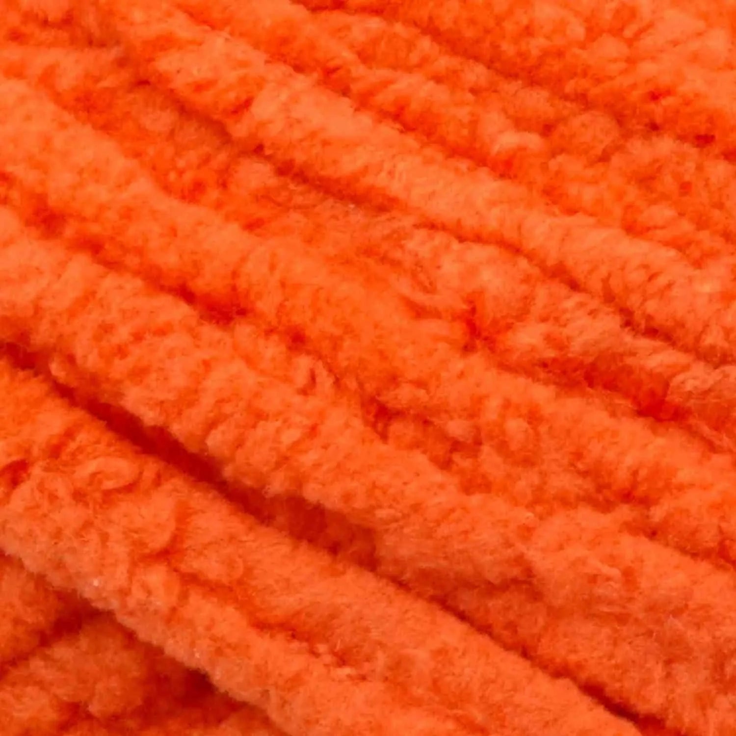 Close-up of bright orange textured fabric