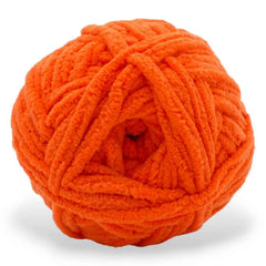 Orange ball of yarn on a white background