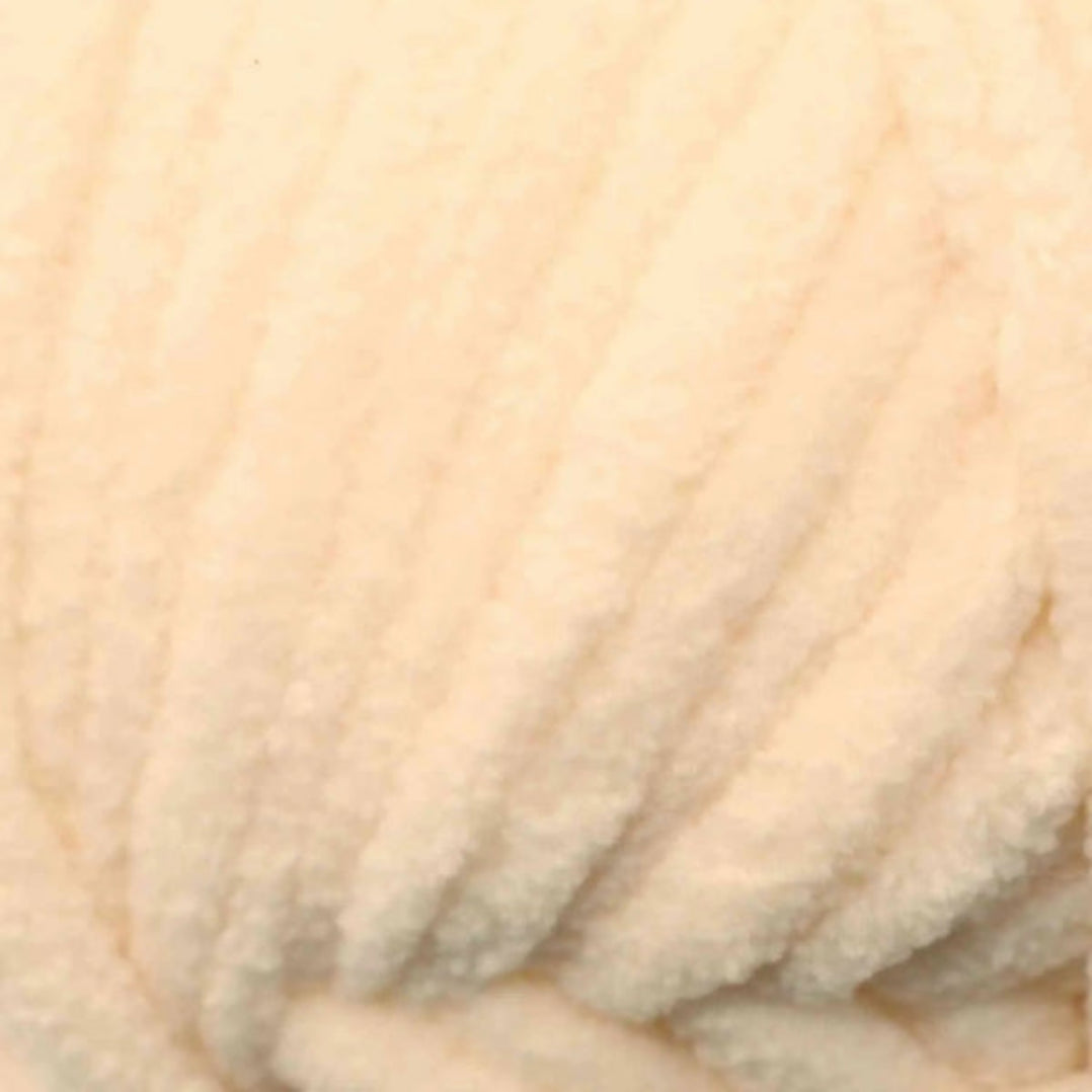 Close-up of beige yarn on a beige background