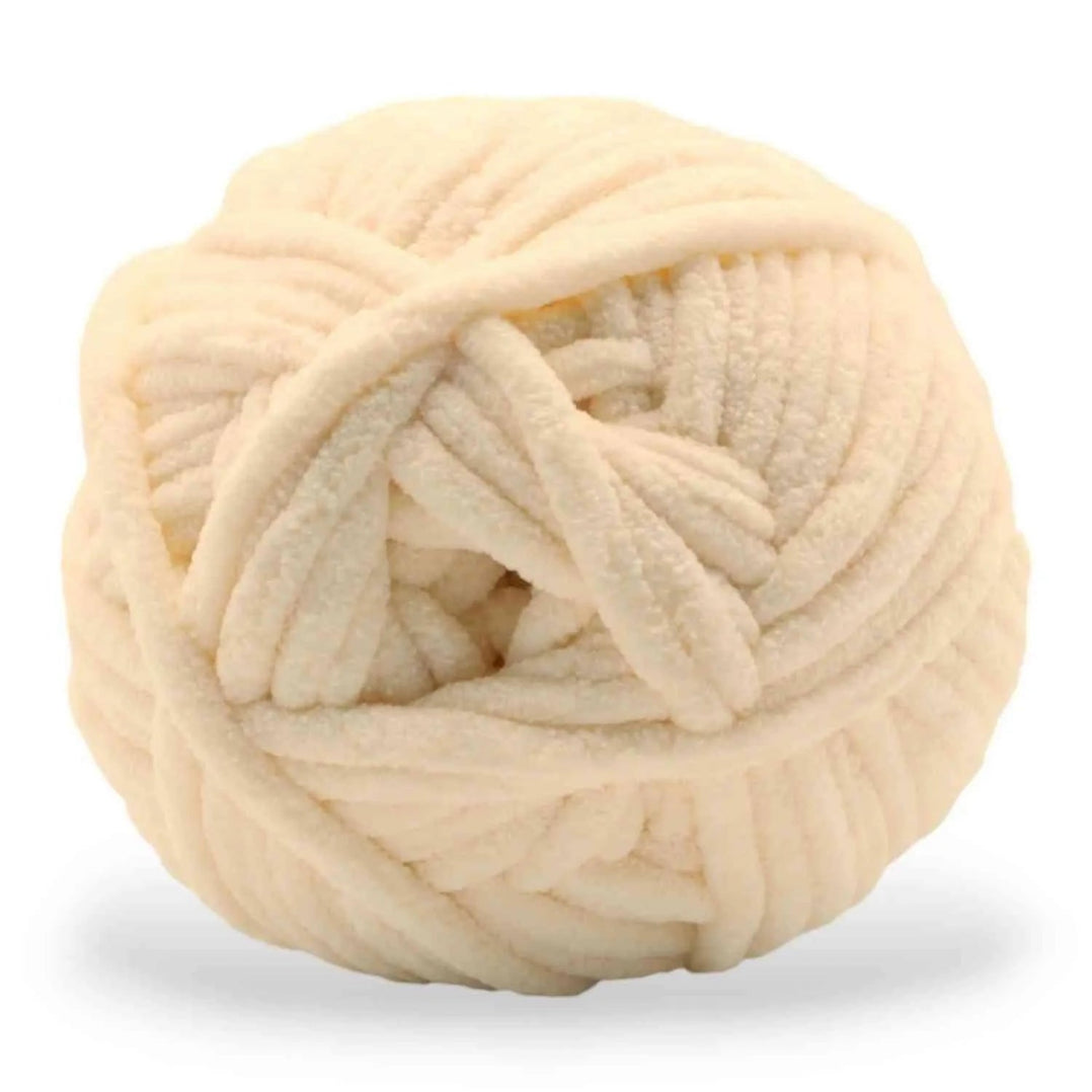 Ball of cream-colored yarn on a white background
