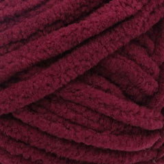 Close-up of a ball of dark red yarn